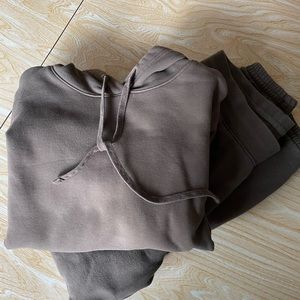 Girlfriend collective sweat pants and sweat shirt in fatigue green, size medium.